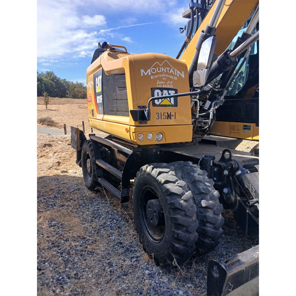 Caterpillar M315 Wheeled Excavator 2019 with a Woodcracker C350 Tree Shear